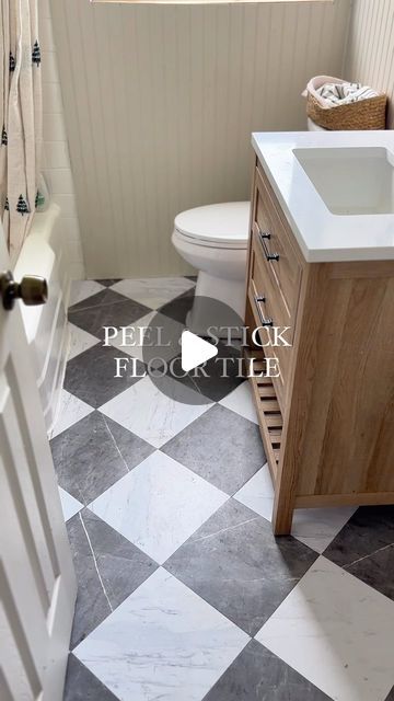 Nattie Jo Powell on Instagram: "Comment “TILE” and I’ll send you the link🔗 to these gorgeous peel & stick floor tiles!!  This is by far my favorite diy bathroom upgrade we’ve done and I love when a project is both budget friendly and holds up well!   #peelandstick #peelandstickflooring #bathroommakeover #renterfriendly #diy" Peel And Stick Flooring Laundry Room, Grout Peel And Stick Floor Tile, Bathroom Remodel Peel And Stick Tile, Renter Friendly Bathroom Floor, Bathroom Floor Stick On Tile, Bathroom Flooring Ideas On A Budget, Peel And Stick Floor Tile Bathroom Diy, Stick On Floor Tiles Bathroom, Diy Bathroom Floor Peel And Stick