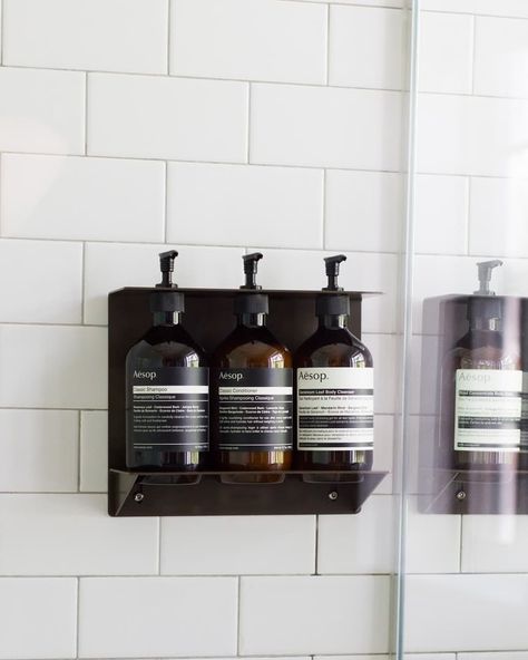 What's in our shower: a curated Aesop routine to cleanse and hydrate from head to toe #skinstore #skincareregimen #skincareregime #skincareproduct #skincarejunkie #skincareaddict #skincareluxury #skincaredaily #skincareroutine #skincaretips #bestskincareproducts #summer #summertime #skincare #beauty #skincareshop #aesop Bathroom Accessories Aesthetic, Brown Cabinet Bathroom Decor, Aesop Bathroom, Aesop Aesthetic, Condo Aesthetic, Hotel Washroom, Extreme Minimalism, Bathroom Amenities, Dresser Decor Bedroom