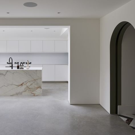 Designed for a busy filmmaker by Gruff Architects, this stunning extension in South London has plenty of star power! We installed over 100m2 of polished concrete through the garden to the open-plan kitchen and living spaces. The glamorous Off White colour brings a dazzling touch of LA chic to the contemporary extension, offsetting the classic original Victorian property. Photo credits: Snook Photography White Kitchen Polished Concrete Floor, White Concrete Floors Living Room, Polished Concrete Floor Kitchen, Concrete Floor Kitchen, White Concrete Floors, Concrete Floors Living Room, Polished Concrete Kitchen, Contemporary Extension, Polished Concrete Floor