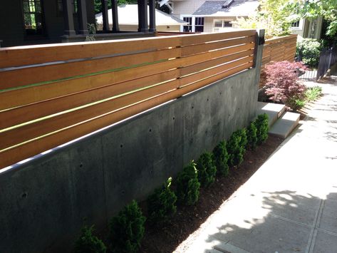 Wood Trellis On Top of Concrete Retaining Wall Retaining Wall Design, Wood Fence Design, Privacy Wall, Wood Trellis, Concrete Retaining Walls, Fence Toppers, Modern Fence Design, Privacy Fence Designs, Cheap Fence