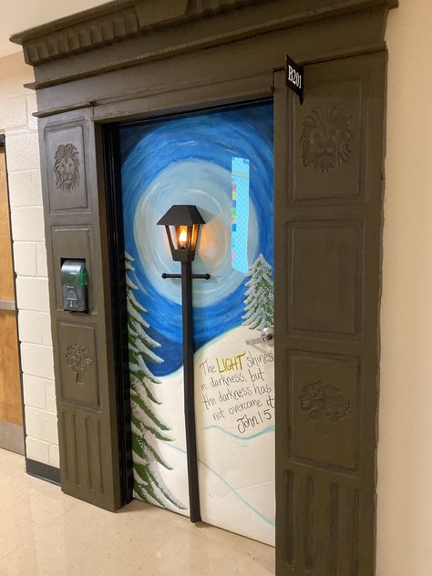 2019 Door Decorating Contest - My classroom door was transformed into a gateway to Narnia with a little help from my hubby. Wardrobe is made from foam insulation. Lamp post is project board and the bulb is wired to go down the post, under the door, and plug in on the other side. Diy Narnia Lamp Post, Lion Witch And The Wardrobe Classroom Door, Narnia Wardrobe Door, Narnia Classroom Door, Narnia Bulletin Board, Narnia Christmas Decorations, Narnia Decorations Ideas, Narnia Wardrobe Diy Cardboard, Narnia Decorations Diy