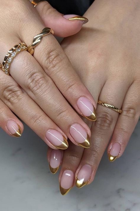 35 Cute & Trendy Gold French Tip Nails Ideas for 2024 Pink And Gold Tip Nails, Almond Shape Gold French Tip, Pink Nail Gold Tip, Almond Nails Gold French Tip, Almond Nails Gold Tips, Pink Nails Gold Tips, Tan French Tip Nails Almond, Almond French With Design, Funky Gold Nails