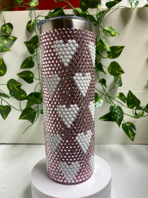 20 ounce insulated bling tumbler. Heart pattern. Light pink and white high shine resin rhinestones. Comes with lid and straw.  Insulated to keep cold drinks cold and hot drinks hot. Stones are placed by hand one at a time so slight variations are to be expected. Rhinestone Tumbler Designs, Bling Tumbler Rhinestones Diy, Bling Cups Rhinestones, Pink And Black Rhinestone Tumbler, Pink Bedazzled Starbucks Cup, Leopard Print Rhinestone Tumbler, Rainbow Rhinestone Tumbler, Blue Wedding Gowns, Diy Rhinestone Crafts