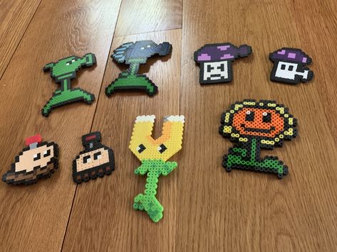 Plants vs Zombies!!! So cool! Zombie Perler Bead Patterns, Perler Plants Vs Zombies, Plants Vs Zombies Cross Stitch, Plants Versus Zombies, Chomper Plants Vs Zombies, Fusion Beads, Plantas Vs Zombies, Plants Vs Zombies, Perler Patterns