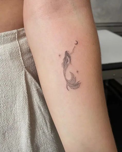 20+ Small Meaningful Tattoos That Pack a Powerful Punch Minimalist Mermaid Tattoo, Small Mermaid Tattoo, Mermaid Tattoo Designs, Single Needle Tattoo, Small Meaningful Tattoos, Fish Tattoo, Mermaid Tattoo, Mermaid Tattoos, Fairy Tattoo