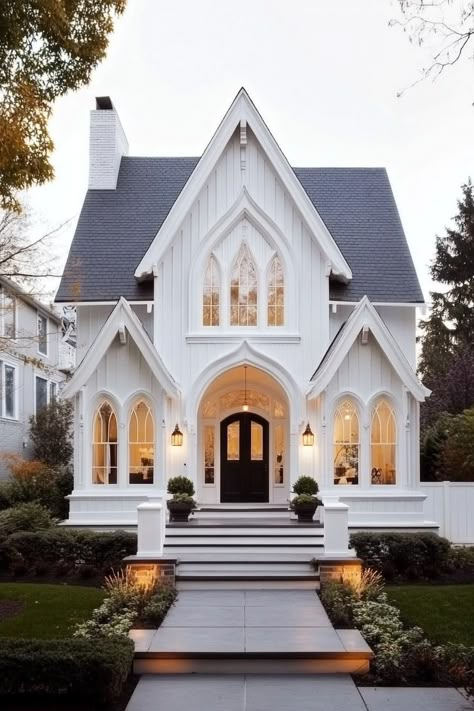 White Gothic Revival house with arched windows. Unlock the charm and eerie elegance of American Gothic style houses, while learning about the playful clash between arches and shadows. Glass Front House, House With Arched Windows, French Home Aesthetic, American Gothic House, Gothic Revival House, Victoria House, White Gothic, Cute Houses, Gorgeous Homes