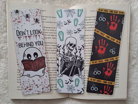 Thriller bookmarks for lovers of all things scary! Choose between Ghosts and spiders, bloody hands and crime scenes or skeletons and coffins. *Made using 350sgm matte cardstock. *ONE SIDED PRINT * Finished off with rounded edges.  If you would like more of a shine to your bookmark I would encourage you to order the marinated option. This also helps your bookmarks stay pristine for longer.  ** Please note due to the nature of recycled card there will be some variation in the cardstock including natural flecks.  The colours of the bookmark may vary from the photo once printed due to screen settings ** Halloween Bookmarks, Bookworm Gifts, Horror Stories, Book Accessories, Spiders, Halloween, Gifts