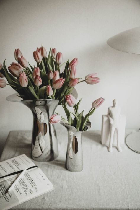 Bloom Botanica is a series of stainless steel vases shaped like an open flower, designed by Danish designer Helle Damkjær as a tribute to Bloom Bowl, a Georg Jensen piece made 20 years ago. Discover more form Georg Jensen! Scandinavian Spring Decor on the dining table. #georgjensen #minimaldesign #homedecor #candleholder #weddinggiftidea #springdecor #scandinavianliving Spring Design Ideas, Scandinavian Design House, Scandinavian Spring, George Jensen, Bohemian Style Interior, Minimalist Interior Style, Open Flower, Minimalist Flowers, Bohemian Interior