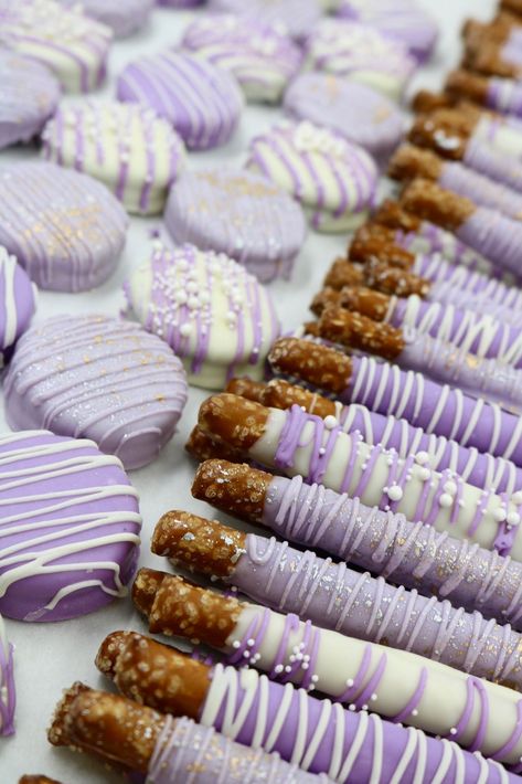 Chocolate Dipped Pretzels and Oreos in colors to match your event are great additions to wedding dessert tables. Adding accents in silver and gold are always elegant options by 3 Sweet Girls Cakery. Purple Dessert Tables, Purple Cake Pops, Pastel Sweets, Lavender Dessert, Purple Desserts, Graduation Party Desserts, Dipped Pretzels, Purple Chocolate, Chocolate Dipped Pretzels