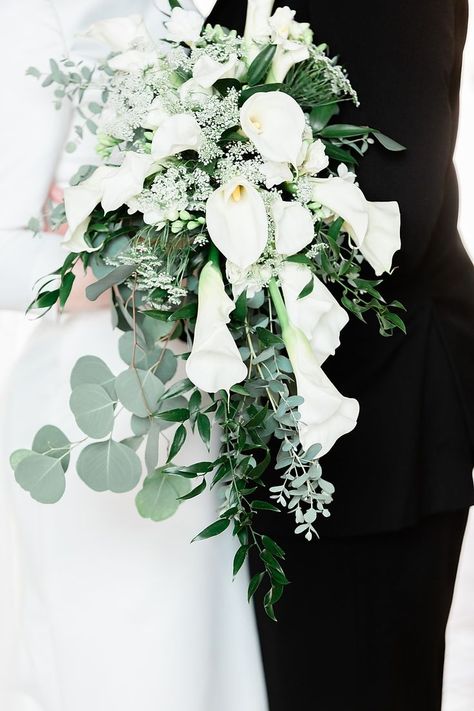 Beautiful cascade calla lily wedding bouquet with greenery at the Marland Mansion in Ponca City, Oklahoma. #callalilybouquet #weddingbouquet #callalily #oklahomawedding #oklahomaweddingphotogapher #marlandmansion Lilly Bouquet Wedding, Calla Lily Wedding Bouquet, Lily Wedding Bouquet, White Calla Lily Bouquet, Calla Lily Bridal Bouquet, Lily Bridal Bouquet, Calla Lily Bouquet Wedding, Calla Lily Bridal, Calla Lily Wedding