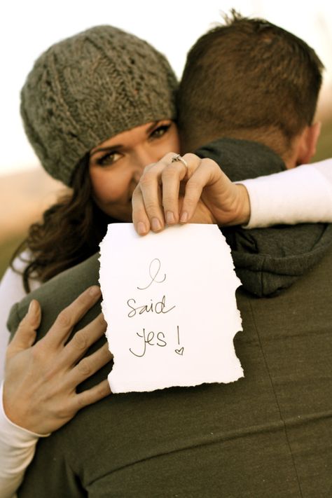 Cute engagement photo - Her left hand should have been the one flat on his back to show off the ring. Right hand holding the sign... Adorable though. Foto Tips, I Said Yes, Winter Engagement, Wedding Engagement Photos, Photo Couple, Tampa Florida, Here Comes The Bride, Wedding Pics, Engagement Pictures