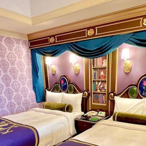 Disney Food Blog on Instagram: "It’s time for HER! ✨🌹✨🌹 The 💙💛Beauty and the Beast themed hotel room💛💙 is the biggest and most detailed of all the character rooms we booked at the Disneyland Hotel in Tokyo Disney! Check out the details: 📚 That library wallpaper in the front entrance hall!!!! 😍 All of the books are Disney stories in French. 🏰 Stained glass detail on bathroom doors 💛 Belle’s dress ruffles as the bed skirt 🕯️Cogsworth and Lumiere silhouettes in the main purple wallpaper 🐶 Sultan ottoman at the desk And so much more! It’s so beautiful! Swipe for a full walkthrough! 👉👉👉" Disney Hotel Aesthetic, Disney Hotel Room, Disney Hotels Room, Sultan Ottoman, Library Wallpaper, Themed Hotel Rooms, Hotel In Tokyo, Disney Hotel, Disney Jasmine