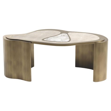 The Paris based label has distinguished themselves since their launch, with their iconic use of shagreen mixed with brass and other exotic materials. All furniture is handcrafted by skilled artisans, ultimately making each piece unique, designed in Paris and produced in the Philippines. The Mask Coffee Table by Kifu Paris is a versatile and organic piece. The amorphous top and base are inlaid in a mixture of cream shagreen, white quartz and bronze-patina brass. This piece is designed by Kifu Aug Kifu Paris, Shagreen Coffee Table, Antique Coffee Table, Antique Coffee Tables, Bronze Patina, Coffee And Cocktail Tables, Table Centers, White Quartz, Center Table