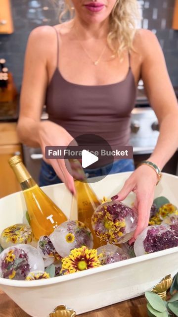 Mackenzie Biehl on Instagram: "DIY fall floral Ice bucket 🍁🍂💐 comment FALL to get the links sent to you! I did this over Valentines Day and it was a hit so I wanted to share for fall! 

I added my fall flowers to a balloon, filled it with water, and put them in the freezer! Once frozen, cut the balloon and peel it off. I ran under colder to keep them more clear. I added fairy lights too! #floralice #fallentertaining #mackdoesflowers" Floral Ice Bucket, Floral Ice, Fall Entertaining, Fall Floral, Fall Flowers, The Balloon, Ice Bucket, Fairy Lights, I Fall