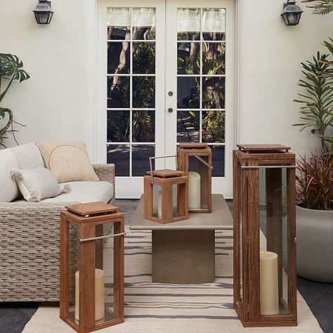 Illuminate your deck, porch or sunroom with our sleek Portside Outdoor Wood Lanterns. A handle makes it extra easy to add warm ambience wherever you need it. KEY DETAILS Acacia wood. Glass surfaces. Suitable for outdoor use. Accommodates West Elm's Pillar candles. Sold individually or as a set of 2, 3 or 4. Made in India.-gray Wood Lanterns, Patio Lanterns, Wood Lantern, Modern Outdoor Lighting, Modern Deco, Outdoor Wood, Affordable Home Decor, Outdoor Lanterns, Wood Glass