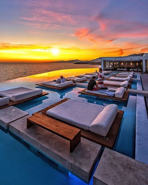 Have you been dreaming of sunsets on the beach???  Try dreaming of viewing the setting sun at the Sunset Pool at Cavo Tagoo Mykonos.  It truly is the idyllic & perfect Greek resort.  Let's plan for the not so distant future!  Contact ToaD at vacations@travelonadream.com to book a trip to Greece- because this too shall pass.  #travelonadream #ToaD #adventureawaits #Mykonos #CavoTagooMykonos #sunsetsoftheworld  📷 @cbezerraphotos Luxury Poolside, Cavo Tagoo, Best Travel Gadgets, Cavo Tagoo Mykonos, Beautiful Vacation Spots, Pool Picture, Sea Nature, Pool Photos, Mykonos Greece