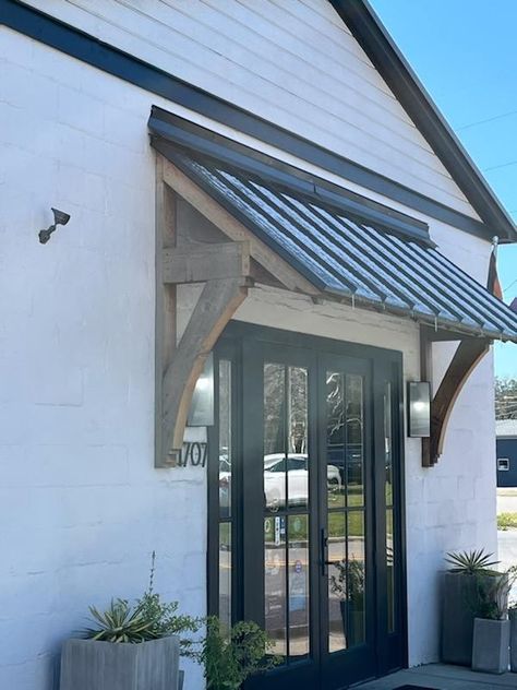 Portico Over Patio Door, Adding Roof Over Front Door, Exterior Awnings For Windows, Door Overhang Ideas Exterior, Front Door Overhang Entrance Metal Roof, Wooden Awnings Over Doors, Metal Window Awnings Exterior, Cedar Gables On House Exterior, Roof Over Garage Door