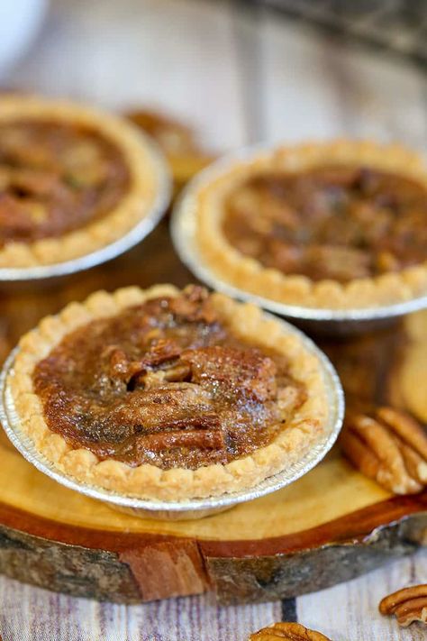 The best Canadian treat are these Maple Pecan Butter Tarts with pecans and maple syrup. These taste just like pecan pie, and is the perfect butter tart recipe. #buttertarts #maplebuttertarts #dessert #easyrecipe Maple Pecan Tarts, Pecan Butter Tarts, Maple Tarts, Best Butter Tart Recipe, Butter Tart Recipe, Pecan Tarts Recipe, Maple Syrup Recipe, Butter Tart Squares, Canadian Butter Tarts