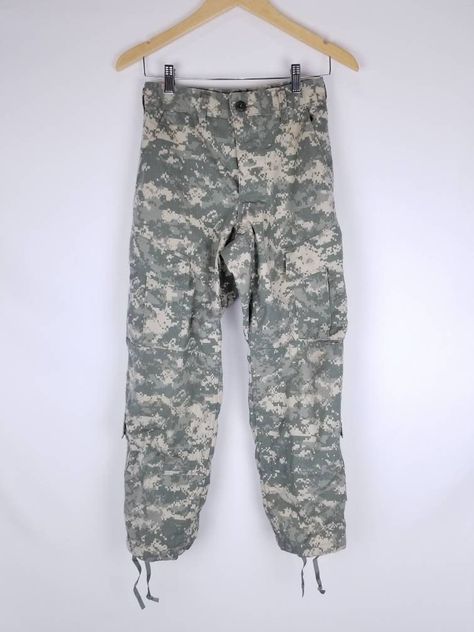 "Authentic Trousers Army Combat Uniform 50% Cotton 50% Nylon. With adjustable with pull up string at the waist and ankles. XSMALL  Waist:25\" Taken  flat without tighten up the pull string  Hips:38\" Rise: 10.5\" Inseam: 28\" Length: 37\" Small Waist: 28\" Taken flat without tighten up the pull up string Hips: 42.5\" Inseam:31\" Length: 37.5\" Conditon: Great condition All  Sales are final. No returns , exchanges or cancellations on orders. Please review shop policies." Cargo Army Pants, Army Combat Uniform, Army Cargo Pants, Button Fly Pants, Combat Uniforms, Army Camouflage, Army Pants, Pants Y2k, Western Jeans