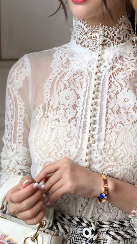 I saw this stunning Pearl Blouse with long sleeves and a turtleneck lace detail, and I couldn't take my eyes off it! It's such a classy piece that would totally elevate any outfit. The lace is just so delicate, adding that perfect touch of elegance. I'm already dreaming of all the outfits I could create with this gem!   What do you guys think? Comment below!   #PearlBlouse #FashionGoals #StyleInspo #ChicFashion #OOTD ✨👗 Pearl Blouse, Blouse With Long Sleeves, My Eyes, Elevate Your Style, Lace Detail, I Saw, Your Style, Chic Style, Fashion Inspo