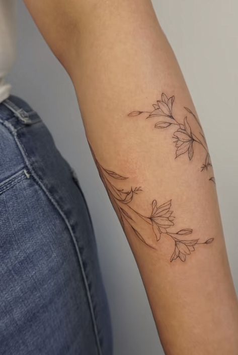 Medium Sized Arm Tattoos For Women, Dainty Lower Arm Tattoos, Delicate Wrap Around Arm Tattoo, Dainty Wrap Around Arm Tattoo, Floral Arm Tattoos For Women, Tattoos On Back Of Arm, Dainty Wildflower Tattoo Forearm, Dainty Floral Arm Wrap Tattoo, Floral Wrap Around Tattoo Forearm