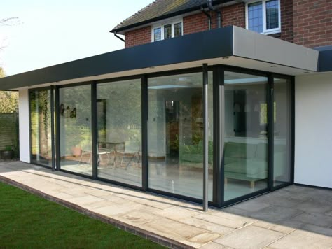 Glass patio enclosure; flat roof Bifold Exterior Doors, Folding Doors Exterior, Folding Patio Doors, Flat Roof Extension, Sliding Glass Doors Patio, Modern Exterior Doors, Glass Doors Patio, Exterior Doors With Glass, Roof Extension