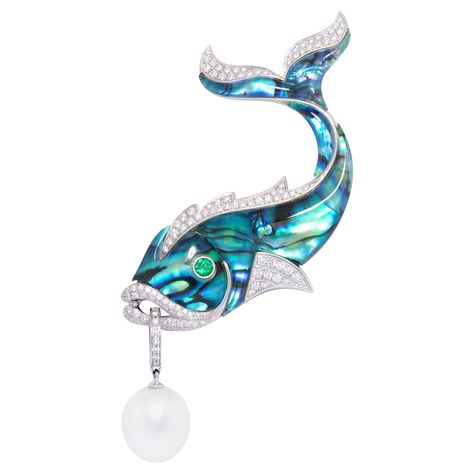 This diamond fish brooch features a stylized fish design with a body in tinted New Zealand paua shell (abalone) topped by transparent crystal, lending the jewel a distinctly art déco look. The design is decorated with 2.80 carats of top quality diamonds (clarity, color and cut). The eye is accented with a faceted emerald. The fish suspends a voluminous Australian South Sea Pearl of 17mm diameter. The pearl is untreated. It displays a splendid nacre and its natural color and luster have not been enhanced in any way. The pearl pendant is detachable and can be worn separately. The brooch is one-of-a-kind. It was handmade in our own workshop in Italy with exquisite knowhow by maestro Pierpaolo, according to an original design by Ella Gafter. The item is signed EG. Conch Pearl, Fish Brooch, Paua Shell, Antique Brooches, Diamond Brooch, Sea Pearl, Sea Pearls, South Sea Pearls, Fish Design