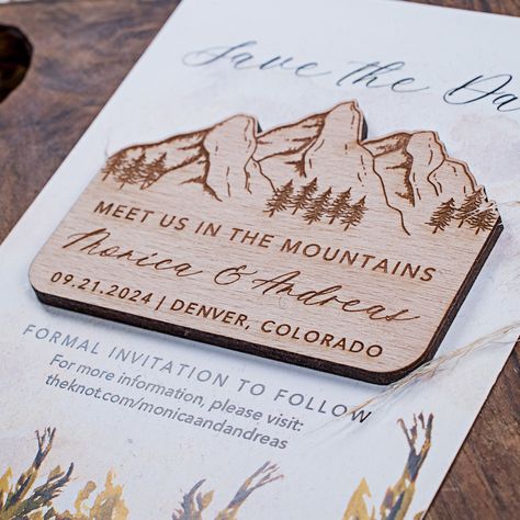 "Mountain wooden save the date magnets with cards PRODUCT INFORMATION  These charming save the date cards are certain to turn heads.  These handsome cards are engraved with the words \"Save the Date,\" and the names of the bride and groom, along with the date of the wedding.  On the flip side of each card is a simple magnet, the better for displaying your announcement on a file cabinet or fridge. Personalized sample is for only 1 magnet without card The save the dates are fully customizable. Just send me a message with your wishes and I will send a free digital proof before purchase.  Magnet size: Each magnet measures approximately 3\"x2\" Card size: Each card measures approximately 4\"x6\" (100mm x 150mm) Kraft Envelope  Material: Wood. Images are with Beech wood. Thickness: 3-4mm PURCHAS Wedding Magnets, Mountain Wedding Invitations, Wedding Magnet, Montana Wedding, Future Wedding Plans, Wood Wedding, Save The Date Magnets, Wedding In The Woods, Forest Wedding