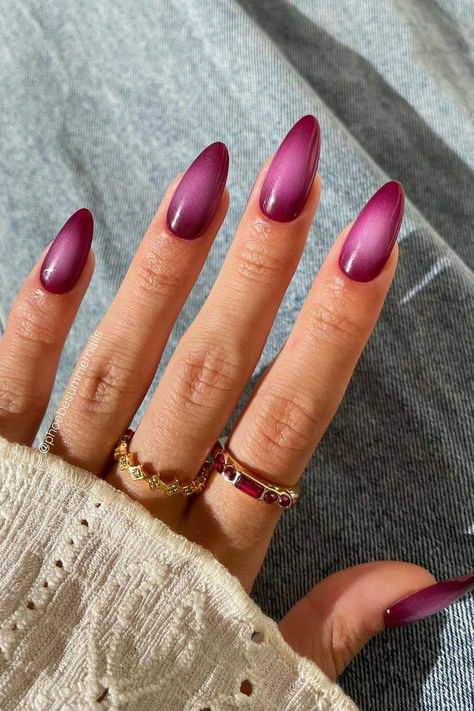 Radiant elegance: Wine red almond nails with a captivating purple aura gradient, a mesmerizing blend of sophistication and charm. // Photo Credit: Instagram @phoebesummernails Purple Polish Nails, Cherry Aura Nails, Aura Nail Designs Almond, Wine Purple Nails, Almond Nails Aura, Blended Nails, Summer Aura Nails, Almond Aura Nails, Red Purple Nails