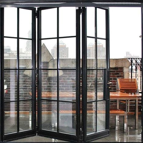 Bifold door, three panels, narrow mullions, clear glass. Ideal if you want to enjoy the view and the fresh air. You can open all the doors folding them, even in small spaces. The door includes a deadbolt, weather seals, clear glass, pulls. Manufactured by Rhino Steel Windows in North America. Rhino ship doors nationwide in the USA 🇺🇸 and Canada 🇨🇦 . Follow and share if you like more doors and windows ideas. Black French Doors, Folding Windows, Steel Doors And Windows, Garage Door Styles, Glass Doors Patio, Sliding Folding Doors, Glass Garage Door, Steel Windows, French Doors Patio