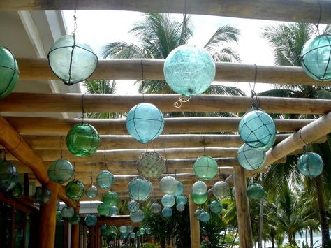 Bamboo pergola with hanging antique Japanese glass fishing floats/buoys in Daco, Philippines. Japanese Glass Fishing Floats, Garden Japanese, Tiki Bars, Glass Fishing Floats, Glass Floats, Fishing Floats, Glass Balls, Beach Living, Reggio Emilia