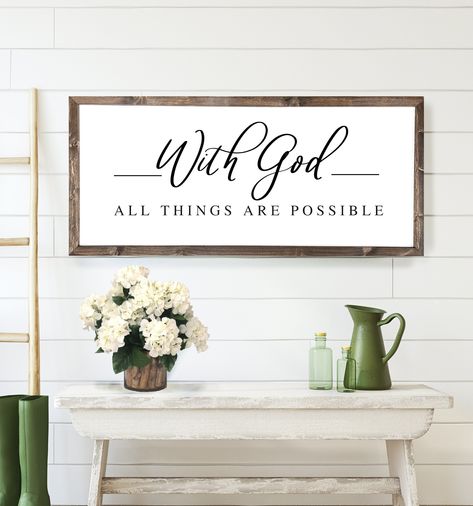 "The beautiful bible verse, \"With God All Things Are Possible\" makes a lovely wood framed sign for your home. This Christian wall art is hand crafted with wood and makes a great gift!   * Choose your size * Professionally printed sign with a solid wood frame * Waterproof and can be easily wiped down * Self leveling hardware attached & ready to display! * Lightweight for easy hanging and rearranging. * Handmade in Lithia, Florida USA * We ship Worldwide Copyright © Mulberry Market Designs Inc." Bible Verse Signs For Home, Girl Apartment Decor, Bible Verse Wall Decor, Bible Wall Art, Catholic Decor, Bible Verse Signs, Scripture Signs, Beautiful Bible Verses, Wood Frame Sign