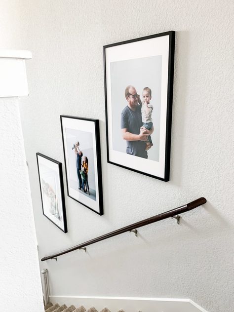 How to hang family photos going up stairwell How To Hang Gallery Wall Up Stairs, Small Foyer Ideas Entryway With Stairs, Pictures In A Stairwell, Family Photos Going Up Stairs, Pictures Going Down Stairs, 3 Picture Frames On Stairs, Frames In Stairwell, Pictures Up A Staircase, Photos Along Staircase