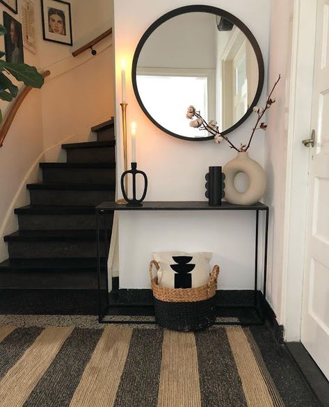 neutral black and cream entryway with striped jute rug, round black rimmed mirror, and collection of vases on console table including a cream donut vase // fort & field Minimalist Entryway Ideas, Black Console Table Decor, Corner Decoration Ideas, Black And Cream Living Room, Donut Vases, Hallway Decorating Ideas, Small Console Table, Corner Decoration, Cream Living Rooms