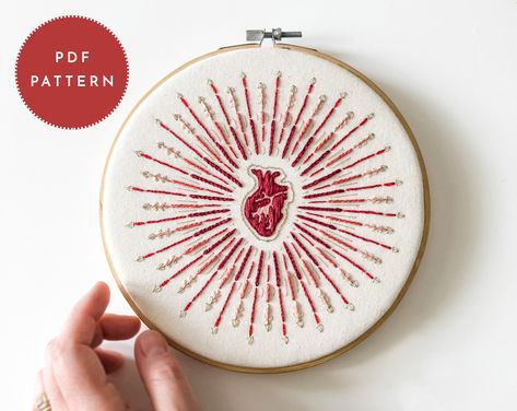 "A vibrant and simple embroidery pattern with gorgeous garnet, red, pink, and coral tones. The perfect project for stitchers who love a pattern that is both challenging and relaxing. Your order comes with the full 8\" pattern, detailed instructions, a transfer guide, and a complete manual for hand embroidery. Stitch this piece for a friend or for yourself! * * * * * * * * * * * * * * * * * * * * MATERIALS INCLUDED: - a detailed pattern document with the full pattern (best on an 8\" inch hoop), f Weird Embroidery, Witchy Embroidery, Guarded Heart, Embroidery Heart, Beginner Embroidery, Embroidery Hearts, Embroidery Sampler, Embroidery Stitch, Garnet Red