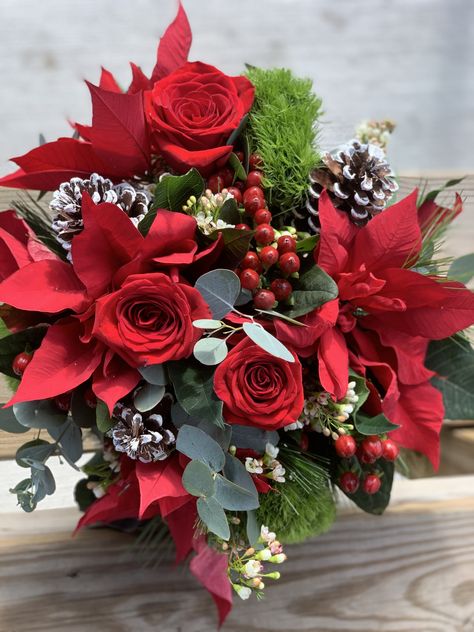 Winter bouquet with roses , pine cones, hypericum berries, and poinsettias Christmas Bridal Bouquet Cascading, Pointsetta Bouquet, Winter Berry Wedding, Christmas Flower Bouquet, Poinsettia Wedding, Christmas Wedding Bouquet, Hallmark Wedding, Poinsettia Bouquet, December Bride