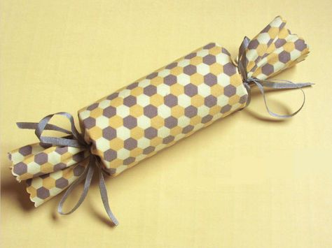 40 Holiday Gift Wrap Ideas | Easy Crafts and Homemade Decorating & Gift Ideas | HGTVRather than attempt to disguise oddly shaped gifts with wrapping paper only barely secured with layer upon layer of tape, artist Denise Sharp of Sharp Studio simply places the gift inside a cardboard tube then covers the tube in colorful fabric and secures the ends with ribbon Wrapping Gifts Ideas, Creative Corporate Gifts, Cute Gift Wrapping Ideas, Origami Gifts, Gift Wrapping Techniques, Handmade Holiday Gifts, Gift Wrapping Inspiration, One Happy Camper, Gifts Wrapping Diy