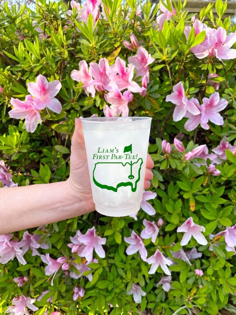 Complete the first birthday party theme with our personalized golf cups! Whether the theme is Hole in ONE or First Par-tee, these custom cups will add the finishing touch to your decor! :: Choose your quantity in the drop-down menu :: Available in 8oz, 10oz, 12oz, 14oz, 16oz, or 20oz :: Top-shelf dishwasher safe  :: Made and printed in USA  :: Sample shown is 16oz cup with forest green ink SHIPPING TIME: Our standard turnaround time for screen printing on cups and napkins is 10-15 business days. Cool One Birthday Theme, Fore Tee Birthday Decorations, Masters Golf First Birthday Party, Masters First Birthday, Par Tee Golf Party, Masters 1st Birthday Party, Masters Themed First Birthday, Golf Birthday Party Kids, 1st Birthday Golf Theme