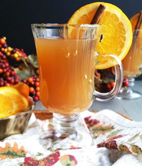 Happy Halloween!!! This Orange Apple Cider Hot Toddy is the ultimate soothing cold weather cocktail! It is a sure way to warm you up after a cool and rainy night. It is easily made with apple cider, fresh orange juice, Amaretto, bourbon and cinnamon. The Amaretto is a welcome sweet addition to this warm cocktail and blends beautifully with the cider and orange flavors. Cranberry Bread Pudding, Apple Cider Hot Toddy, Cold Apple Cider, Cinnamon Cocktail, Hot Toddy Recipe, Spiked Cider, Warm Cocktails, Toddy Recipe, Cider Bar