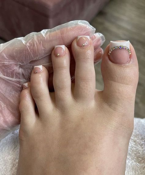 Pedicure With Stones, French Tip Toe Nails With Rhinestones, Acrylic Toes With Diamonds, White Toes With Rhinestones, French Pedicure With Rhinestones, French Tip Toes With Rhinestones, French Tip Toes With Design, Toes With Rhinestones, Emoji Nails