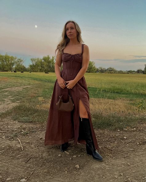 Somewhere out west ⛰️🌾🪵👢 #ootd #ootdshare #weddingguestdress #fallwedding #bohowedding #petitefashion #revolveme #westernfashion Wedding guest dress, farm wedding guest dress, fall wedding guest dress, brown maxi dress, western wedding guest dress, cowgirl boots, western dress, formal dress, fall fashion, petite fashion Country Style Wedding Guest Outfit, Western Outfits Women Wedding Guest, Country Wedding Guest Dresses With Boots, Western Boots And Dress Outfit, Farm Wedding Guest Dress, Western Semi Formal Attire, Wedding Dress With Cowgirl Boots, Wedding Guest Dress With Cowboy Boots, Western Wedding Dresses Guest