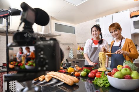 Mother and daughter cooking in the kitchen by amenic181. Mother and daughter blogger vlogger and online influencer recording video content on healthy food #Sponsored #blogger, #vlogger, #kitchen, #Mother Cooking Influencer, Mother And Daughter Cooking, How To Start Youtube, Cooking In The Kitchen, Recording Video, Youtube Cooking, Video Content Marketing, Food Stock, Youtube Channel Ideas