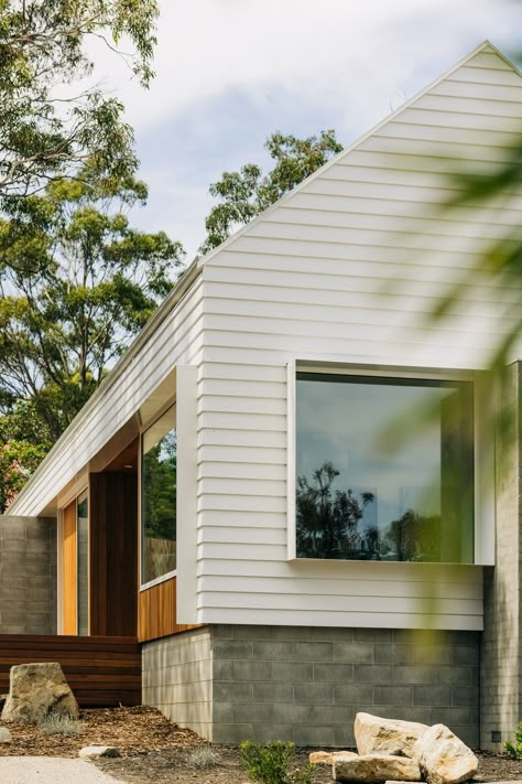 Introducing Bluff House by @PrestonLaneArchitects, nestled amongst the eucalyptus in the beach-side community of Spring Beach, Tasmania.

‘We like to keep ideas as simple and elegant as possible to let the materials speak for themselves,’ says Daniel Lane of Preston Lane, who have designed a clean-cut beach house using Linea™ Weatherboard by James Hardie. ‘We seek solutions that will stand the test of time.’

Learn more about this unique modern home on the blog! Box Modern House, Alpine House, Weatherboard House, Gable House, Granny Flats, House Cladding, Bungalow Renovation, James Hardie, Miller Homes