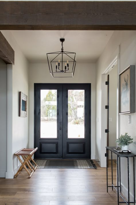 Double door entry that leads into a contemporary-style foyer. Geometric pendant lights and slim, black side tables create a crispness that is also inviting. Double Door Entryway, Open Concept Great Room, Modern Entry, Modern Entryway, Room Vibes, Hal Decor, Foyer Design, Entryway Ideas, Front Entrance