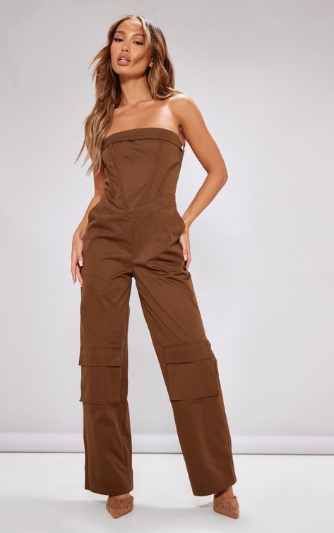 Add some edge to you look with this petite brown corset detail cargo jumpsuit. This jumpsuit is brought to you in a brown material with a cargo style and a figure-flattering corset design, what's not to love This jumpsuit is everything we're loving for you day to night styling. Style with high heels and gold accessories for a look that won't let you down.   Length approx 130cm/51 (Based on a sample size UK 6)   Model wears size UK 6/ EU 34/ AUS 6/ US 2 Romper Outfit With Jacket, Petite Romper, Brown Corset, Brown Jumpsuits, Cargo Jumpsuit, Petite Jumpsuit, All Black Dresses, Bodycon Dresses Casual, Corset Crop Top