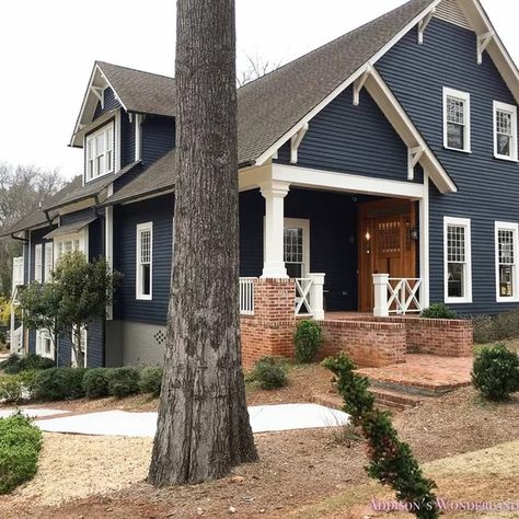 8 Siding Colors That Go Beautifully With Red Brick Exteriors | Hunker Brick House With Blue Shutters, Grey Painted Brick House, Grey Painted Brick, Dark Blue Houses, Farmhouse Exterior Colors, White Farmhouse Exterior, Painted Brick House, Blue Shutters, Exterior House Color