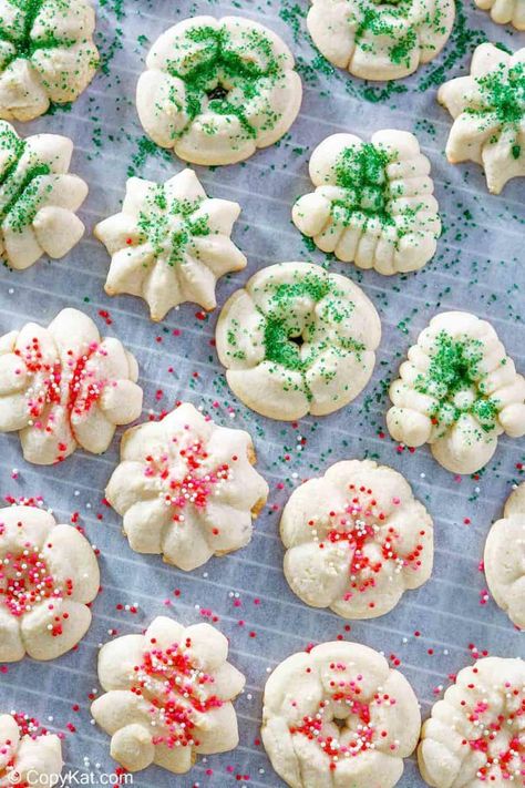 Cream Cheese Spritz Cookies are buttery with lovely almond flavor. Get the easy recipe and find out how to make the best spritz cookies with cream cheese using a cookie press. These old fashioned cookies are great for homemade holiday gifts and Christmas cookie exchanges. #spritz #easycookierecipes #christmascookie #creamcheesecookies Cream Cheese Spritz Cookie Recipe, Best Spritz Cookie Recipe, Cream Cheese Spritz, Cream Cheese Spritz Cookies, Cookie Press Recipes, Christmas Spritz Cookies, Biscuits Halloween, Spritz Cookie Recipe, Easy To Make Cookies