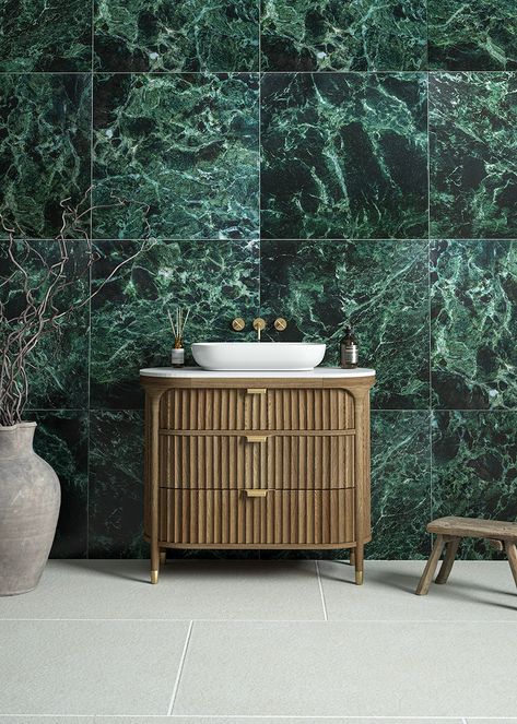 The Ravello Verde is a vibrant emerald green marble effect tile with realistic detailing, perfect as a statement floor or wall tile for bathrooms. The detailed print makes this marble effect porcelain hard to distinguish from a real marble. Available in a versatile 600 x 600 size with both matt and gloss finishes. Rectified: Yes R Rating: R9 Variation: Low, V2 Pattern Repeat: 54 tiles Tiles Per Box: 4 tiles Composition: Porcelain Green Floor Tiles Bathroom, Marble Green Bathroom, Green Tile Bathroom Ideas, Green Floor Tiles, Emerald Green Bathroom, Quorn Stone, Green Ceramic Tile, Emerald Green Marble, Green Marble Bathroom