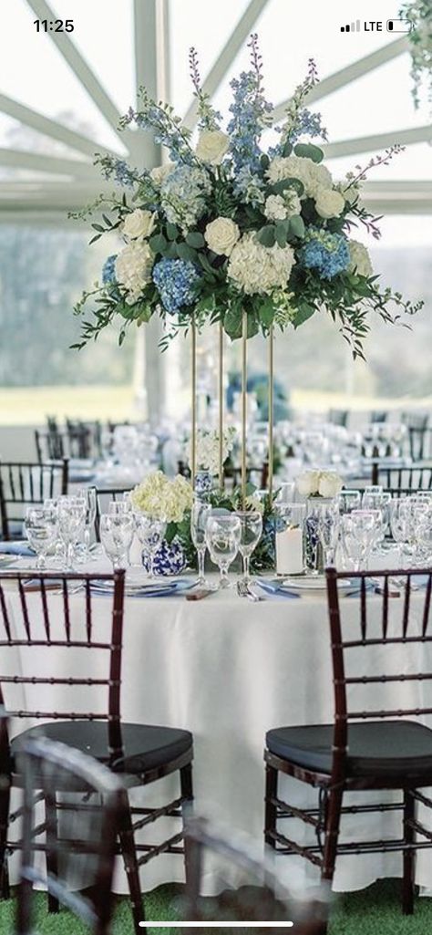 Icy Blue And Navy Wedding, Blue Wedding Venue Decorations, Wedding Table Decor Blue And White, Navy Floral Centerpieces, Dusty Blue Winter Wedding Table Settings, Navy Blue Flower Centerpieces, Floral Centerpieces For Round Tables, Gold White And Blue Wedding, Gold Wedding Centerpieces Elegant