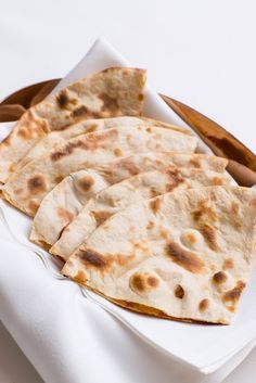 Peter Joseph of Michelin-starred Tamarind shares his roti recipe. Incredibly simple to make at home, roti contain only four ingredients. Recipes Quesadillas, Make Naan Bread, Lentils Vegan, Tandoor Oven, Tandoori Roti, Savoury Bakes, Roti Recipe, Great British Chefs, Vegan Bread